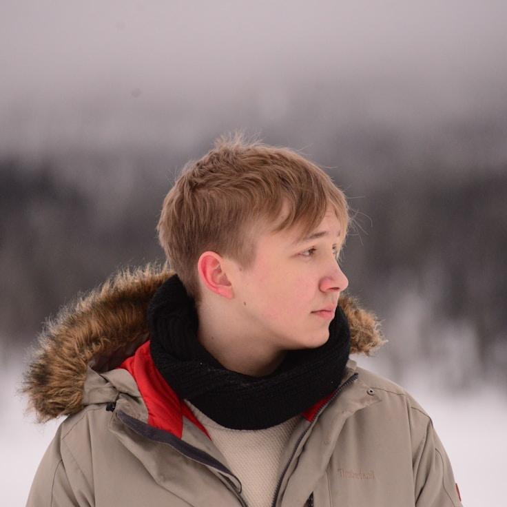 Alex Chen, Lead Design Curator at TrailAzureRock, reviewing corporate floral arrangements